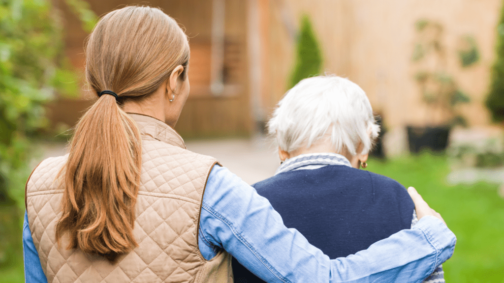 woman with her arm around a senior