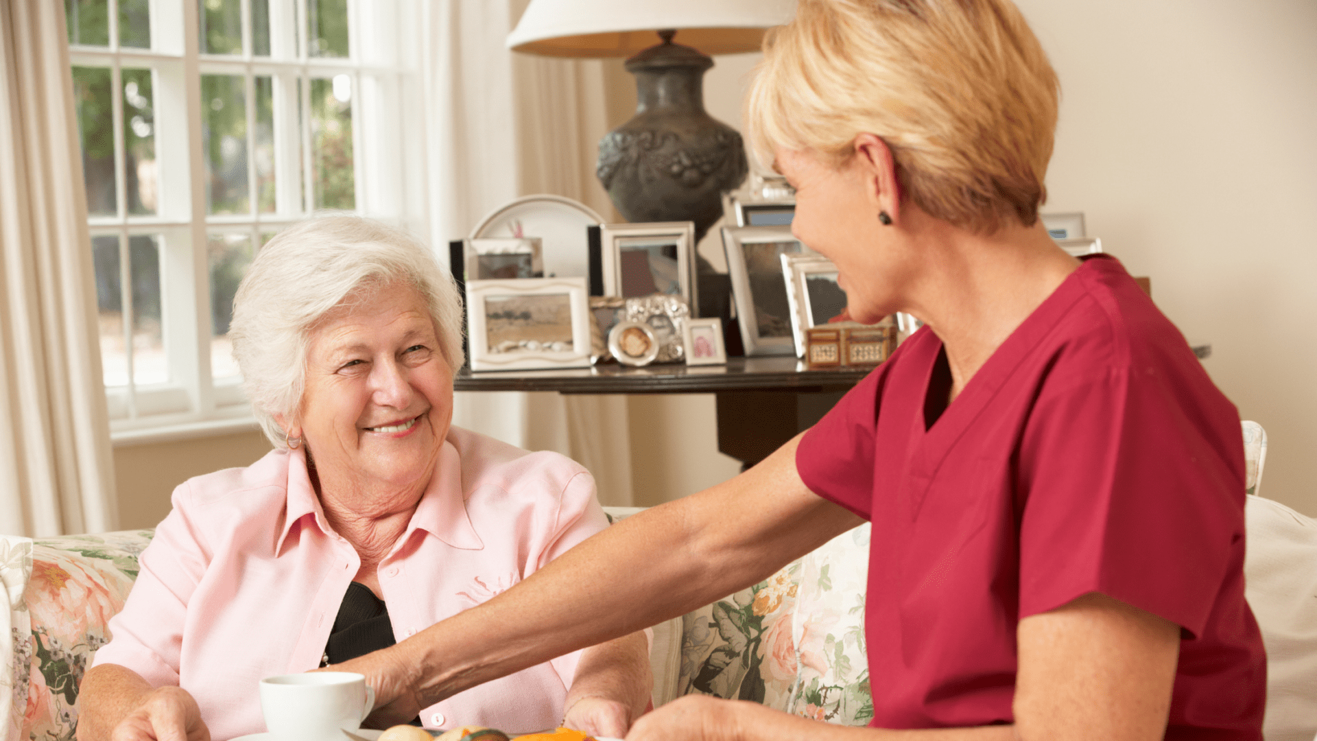 female employee at Grace Pointe smiling at an older woman